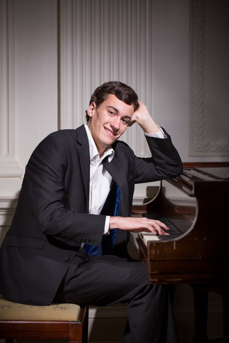 Senior boy by a scenic lake